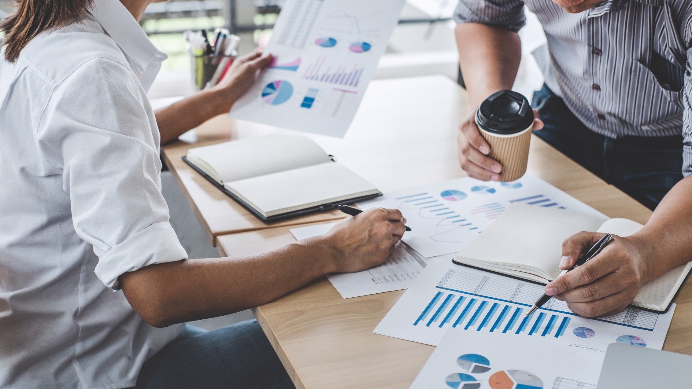 Business colleagues planning operations with working capital