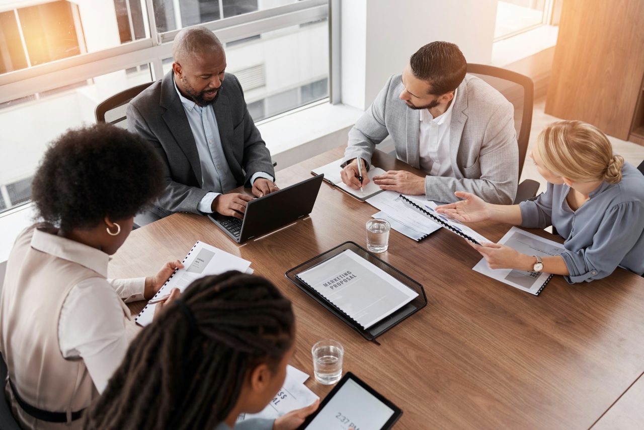Team planning financial strategy after debt refinance