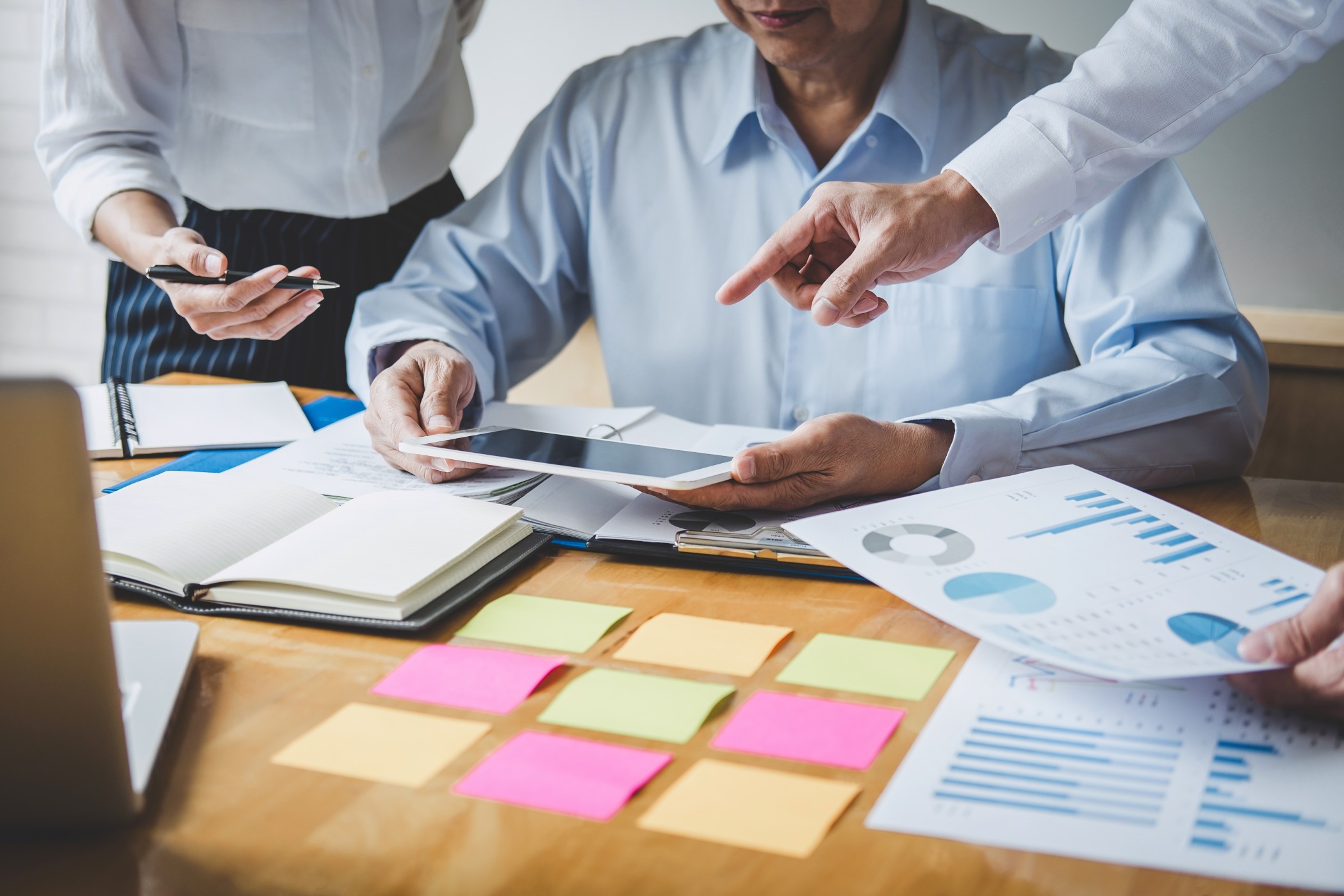 Team collaborating on growth funded by revenue-based financing