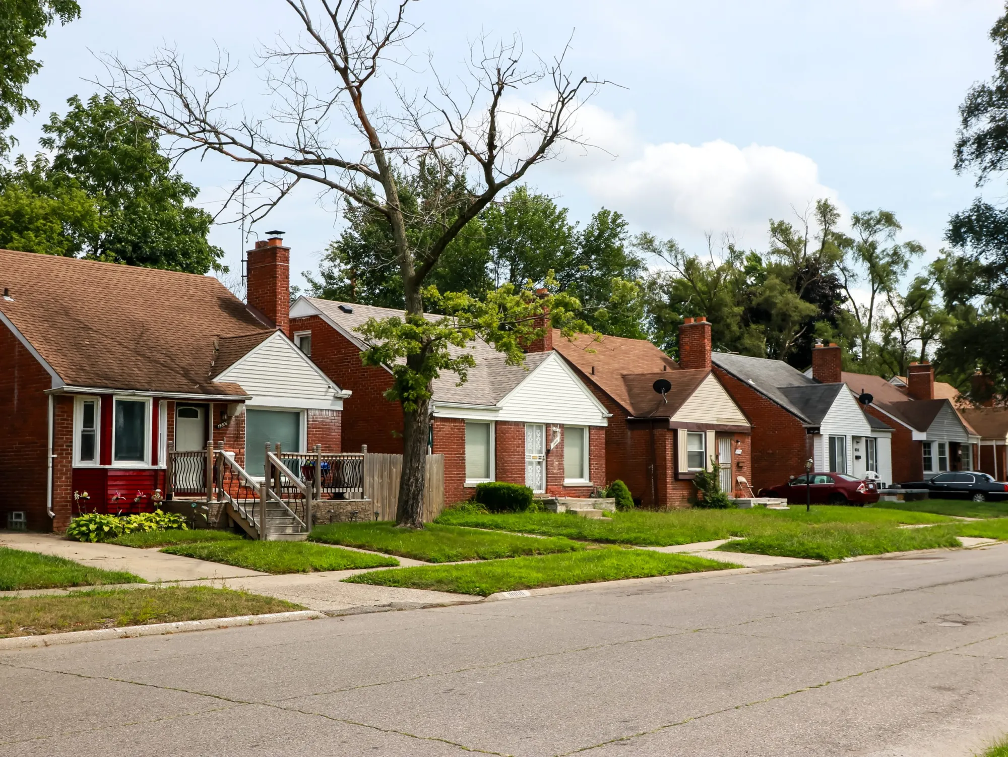 Row of rental houses representing investment portfolio