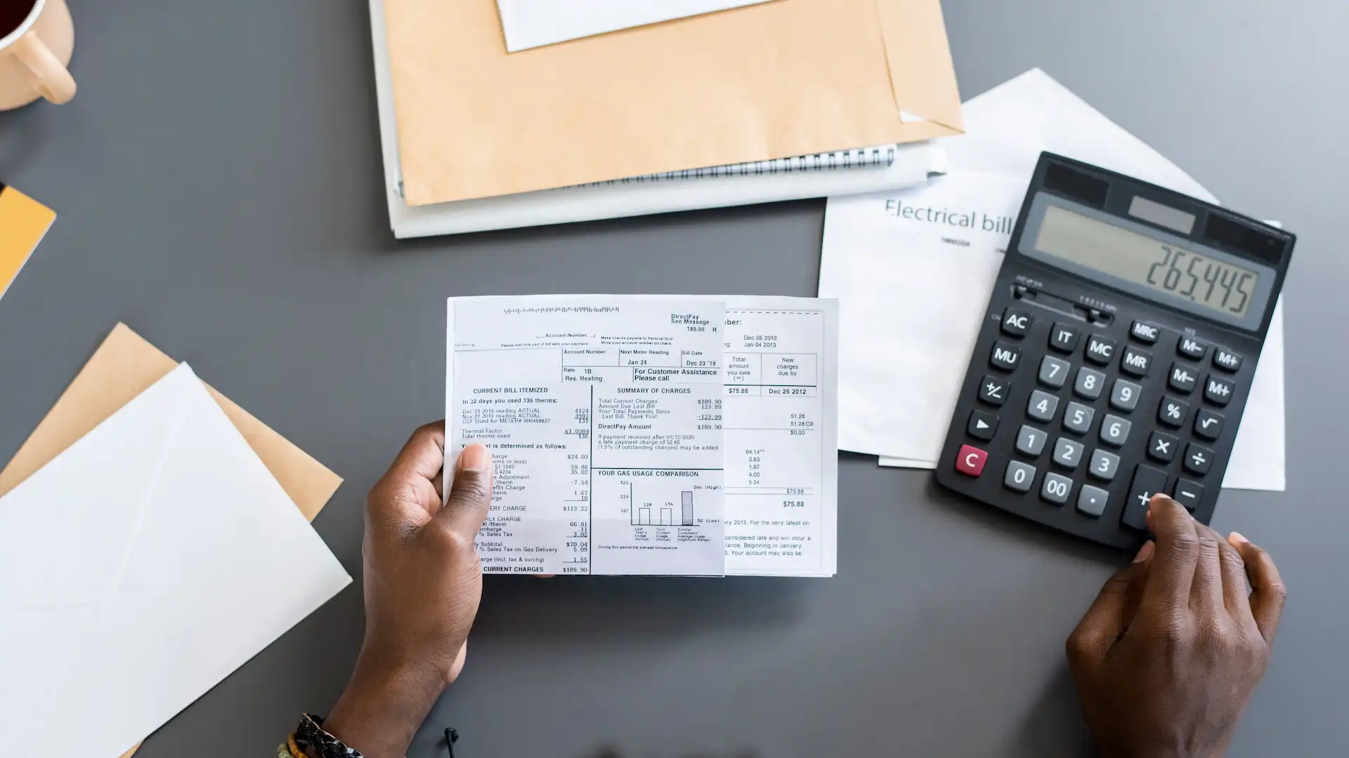 Calculator and documents representing invoice financing calculations