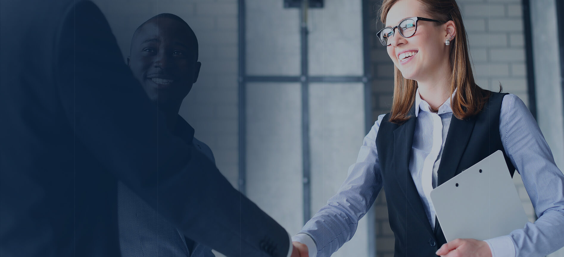 Business partners shaking hands after acquisition deal